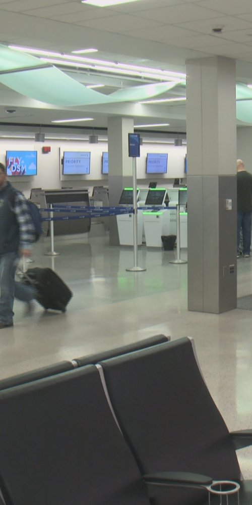 Mother and child resting in quiet room at Des Moines Intl Airport
