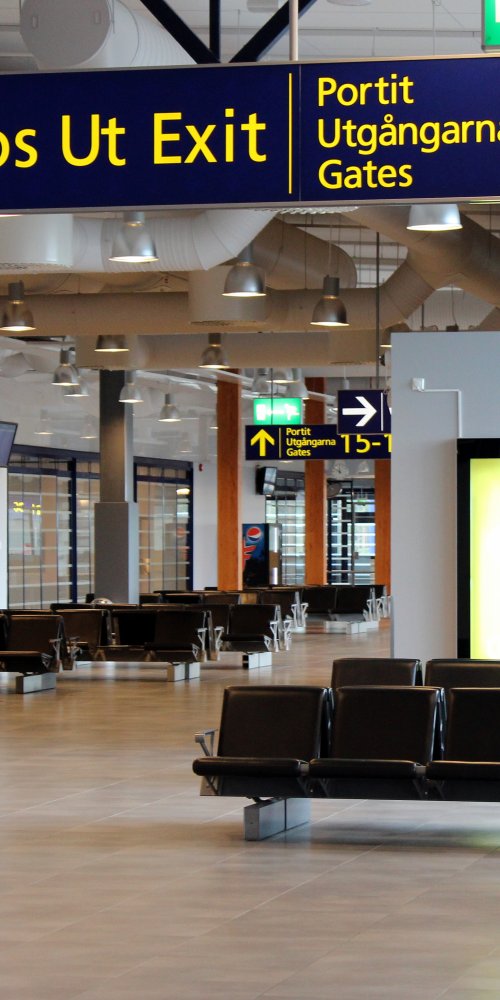 Mother and child relaxing in Oulu Airport lounge
