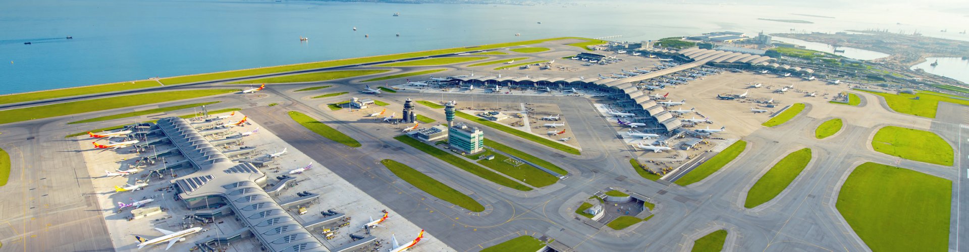 Sunset view of Hong Kong Intl Airport terminal building