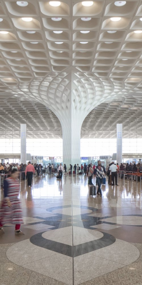 Family relaxing in lounge at Chhatrapati Shivaji Maharaj International Airport, IN Airport