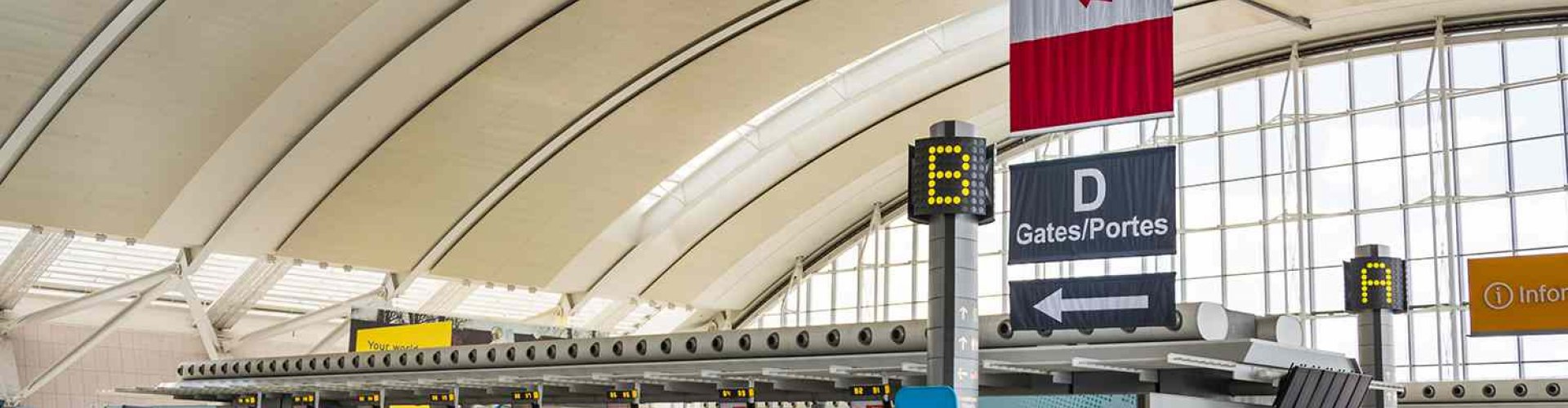 Sunset view of Toronto Pearson Airport terminal exterior illuminated