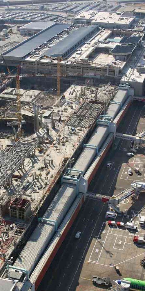 Parents and children relaxing in quiet family lounge at O. R. Tambo Airport