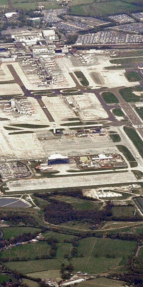 Mother and toddler resting at Gatwick Airport family zone